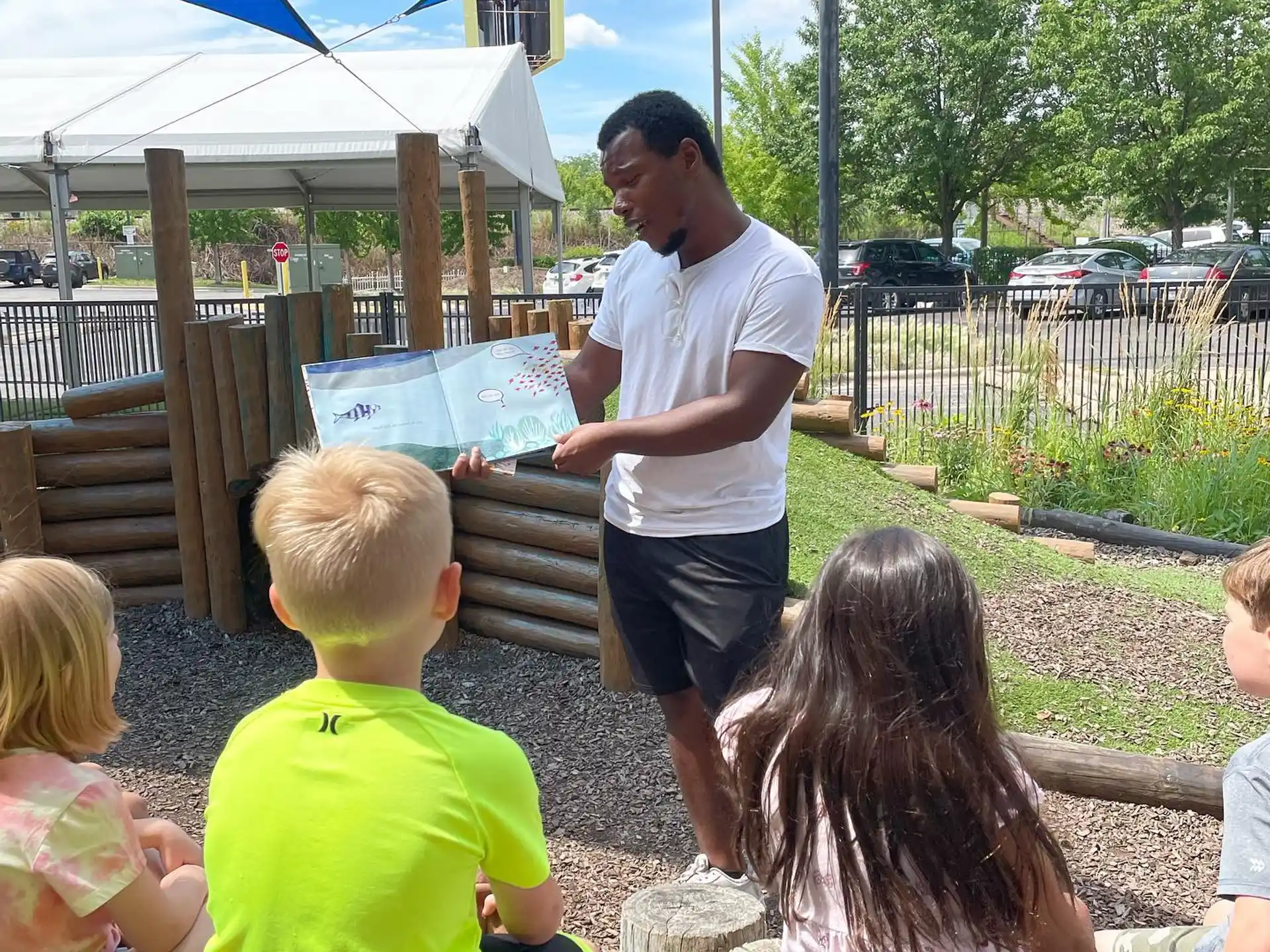 a man standing in front of a group of children