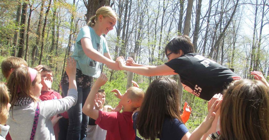 a group of people in a forest