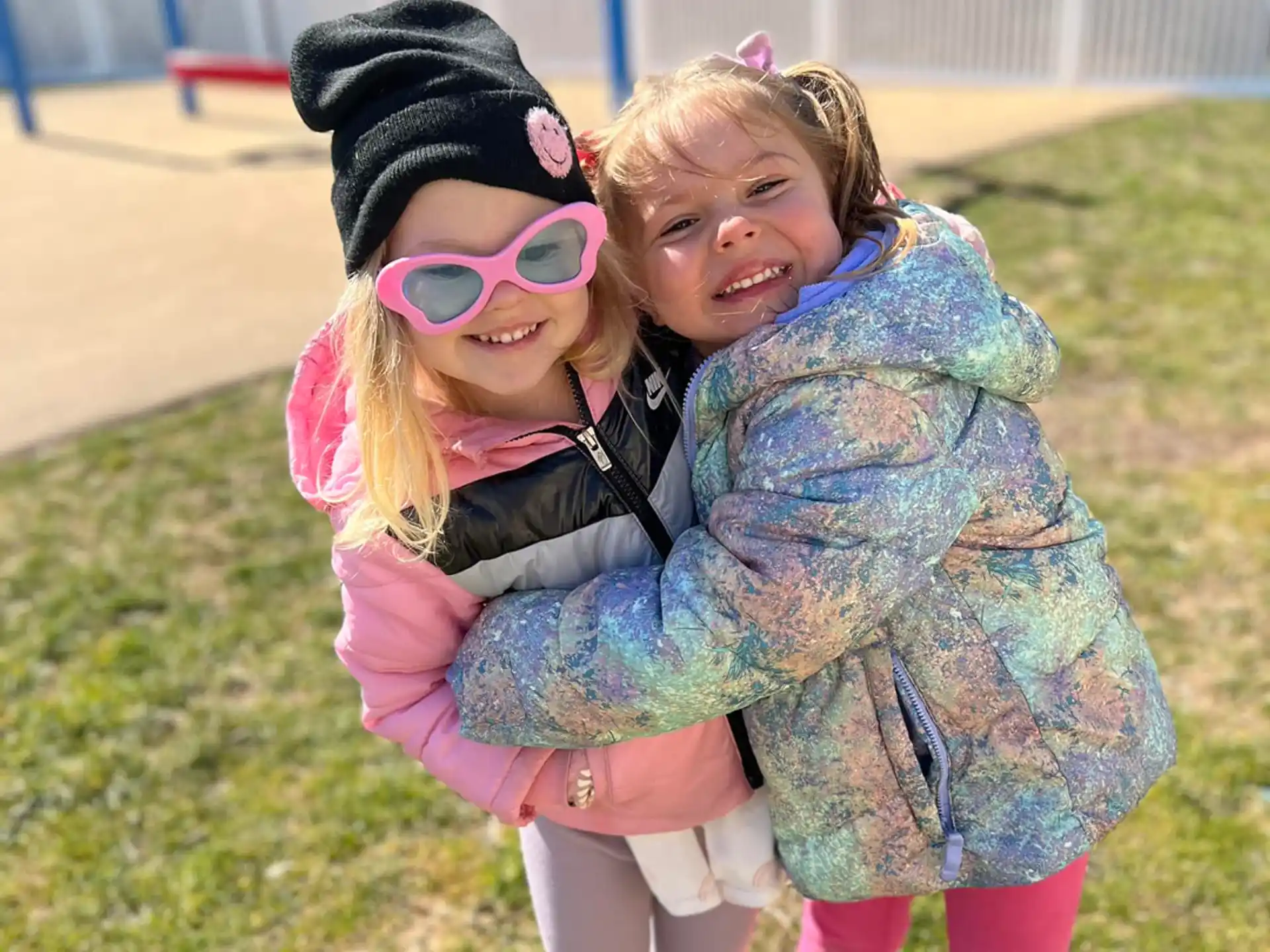 a couple girls hugging