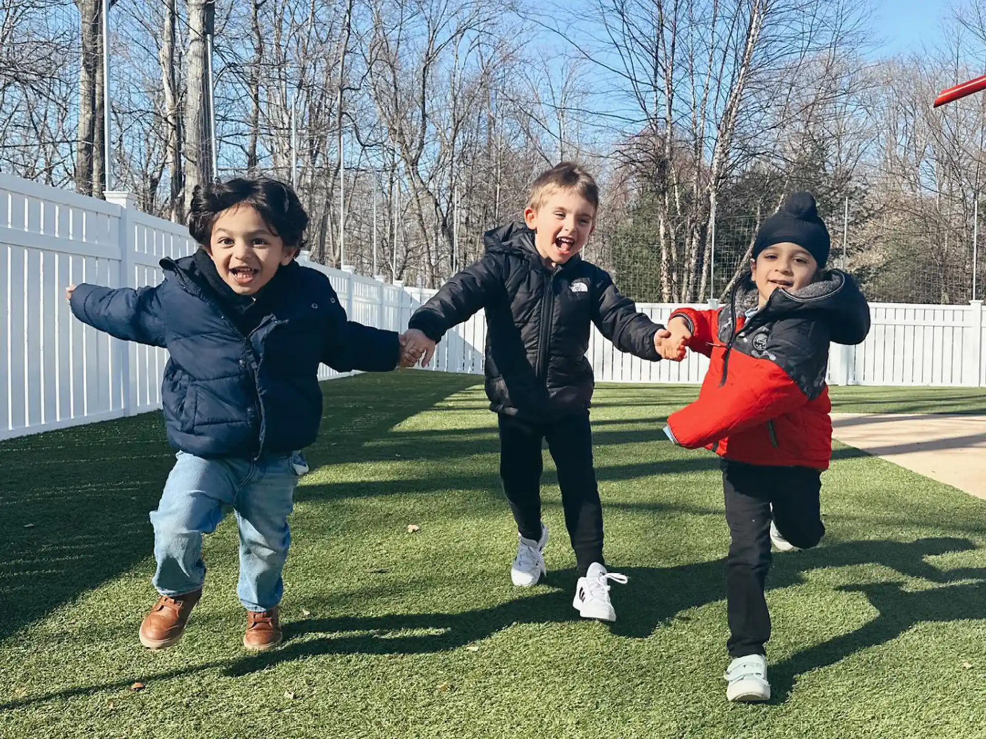 a group of kids playing with a frisbee
