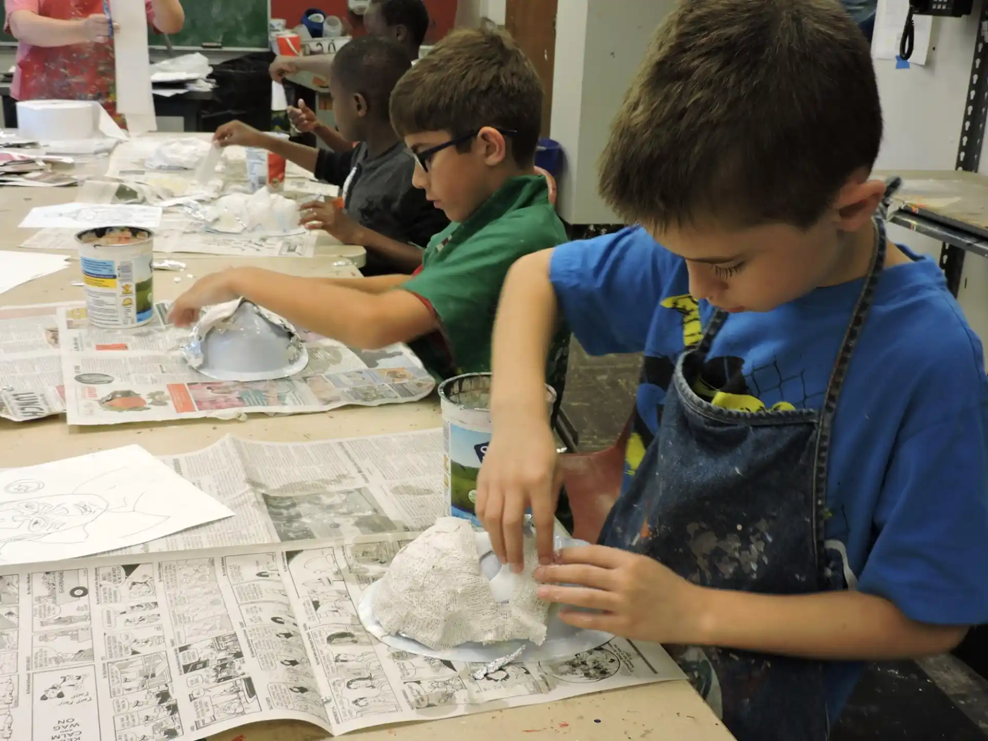 a group of boys working on a project
