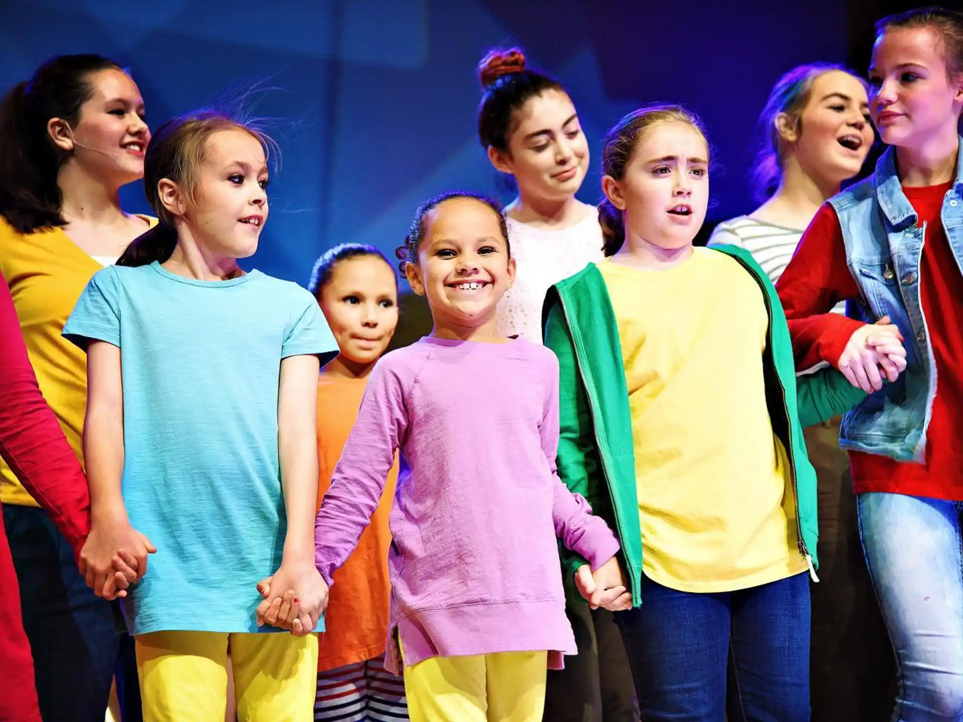 a group of girls in matching outfits