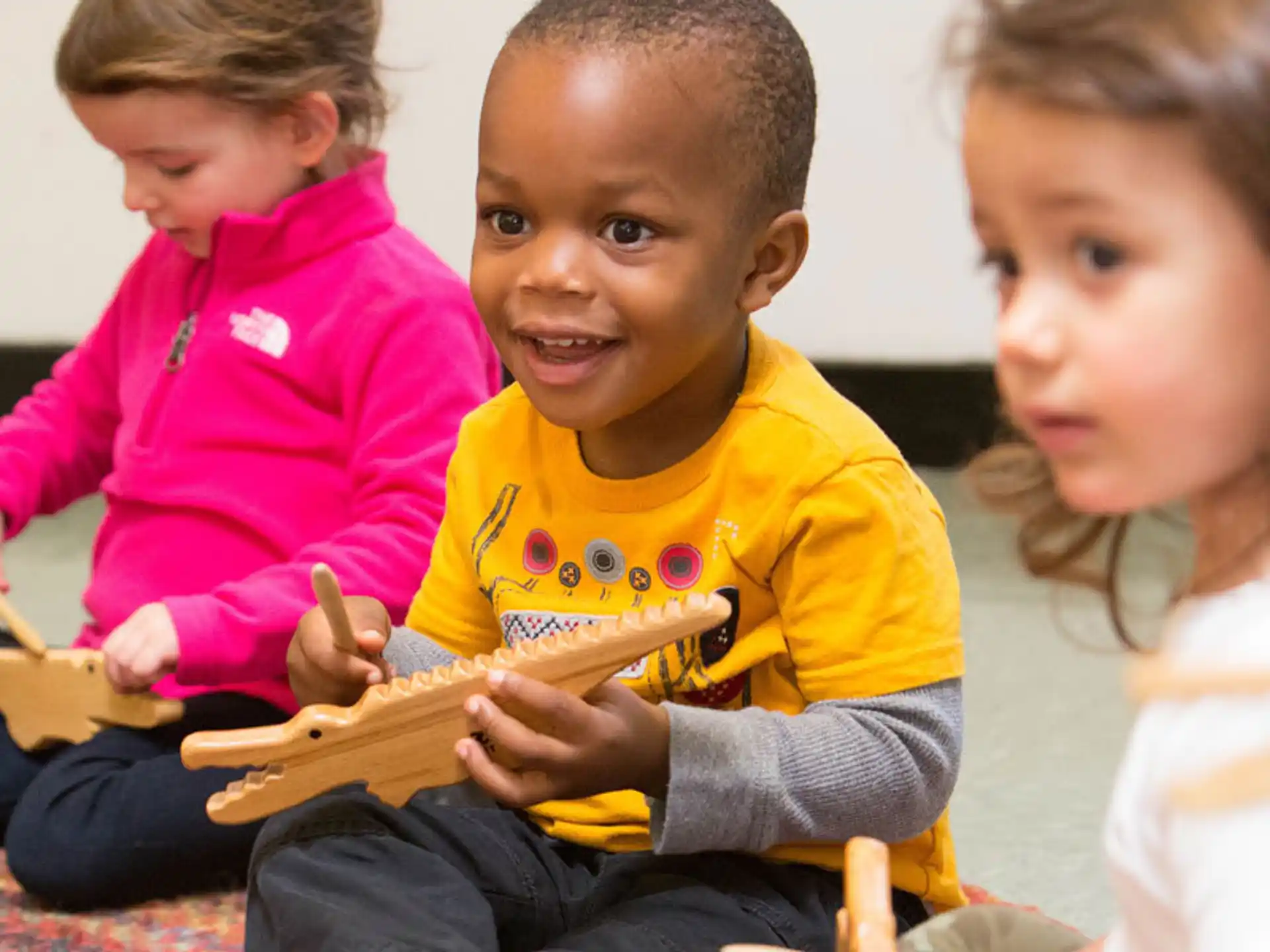 a group of children sitting on the floor