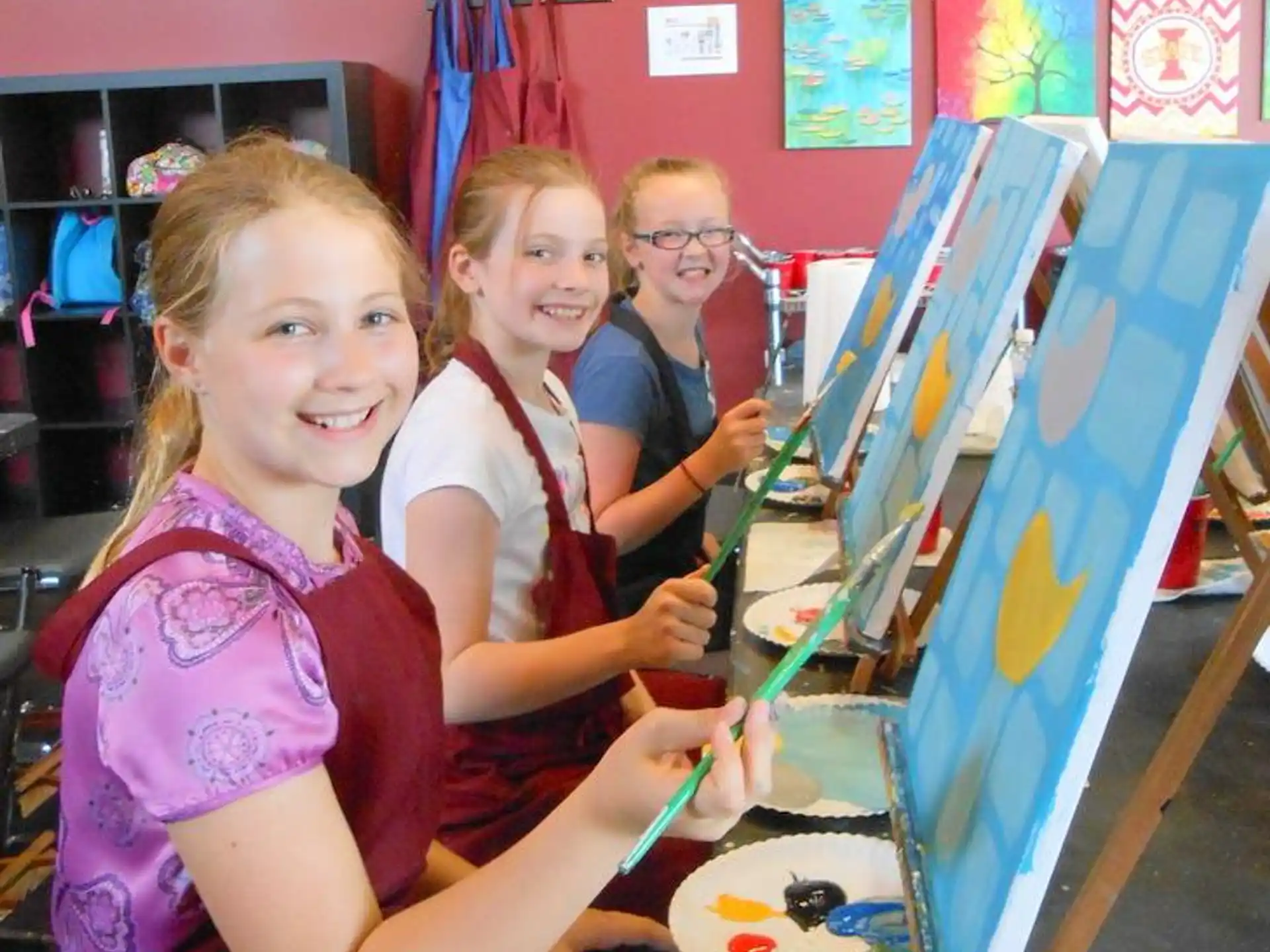 a group of girls painting