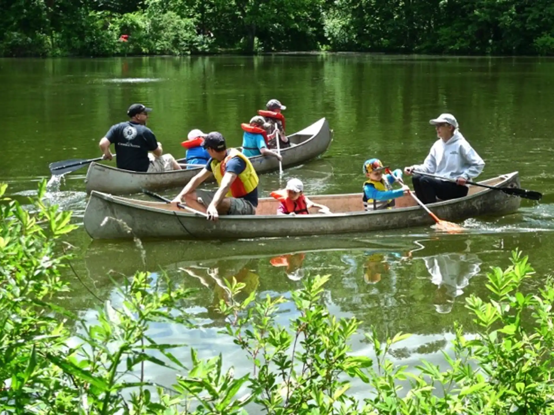 a group of people in a canoe