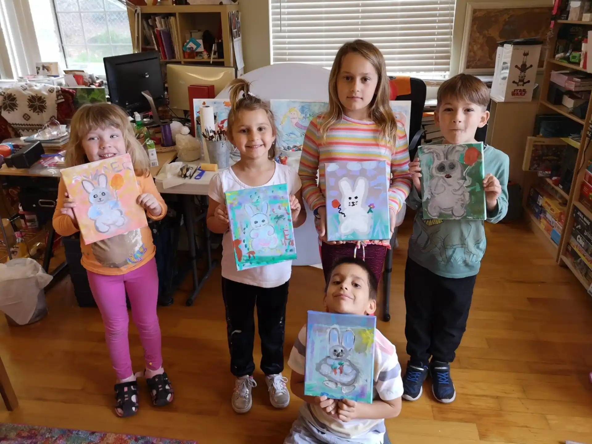 a group of children holding up posters