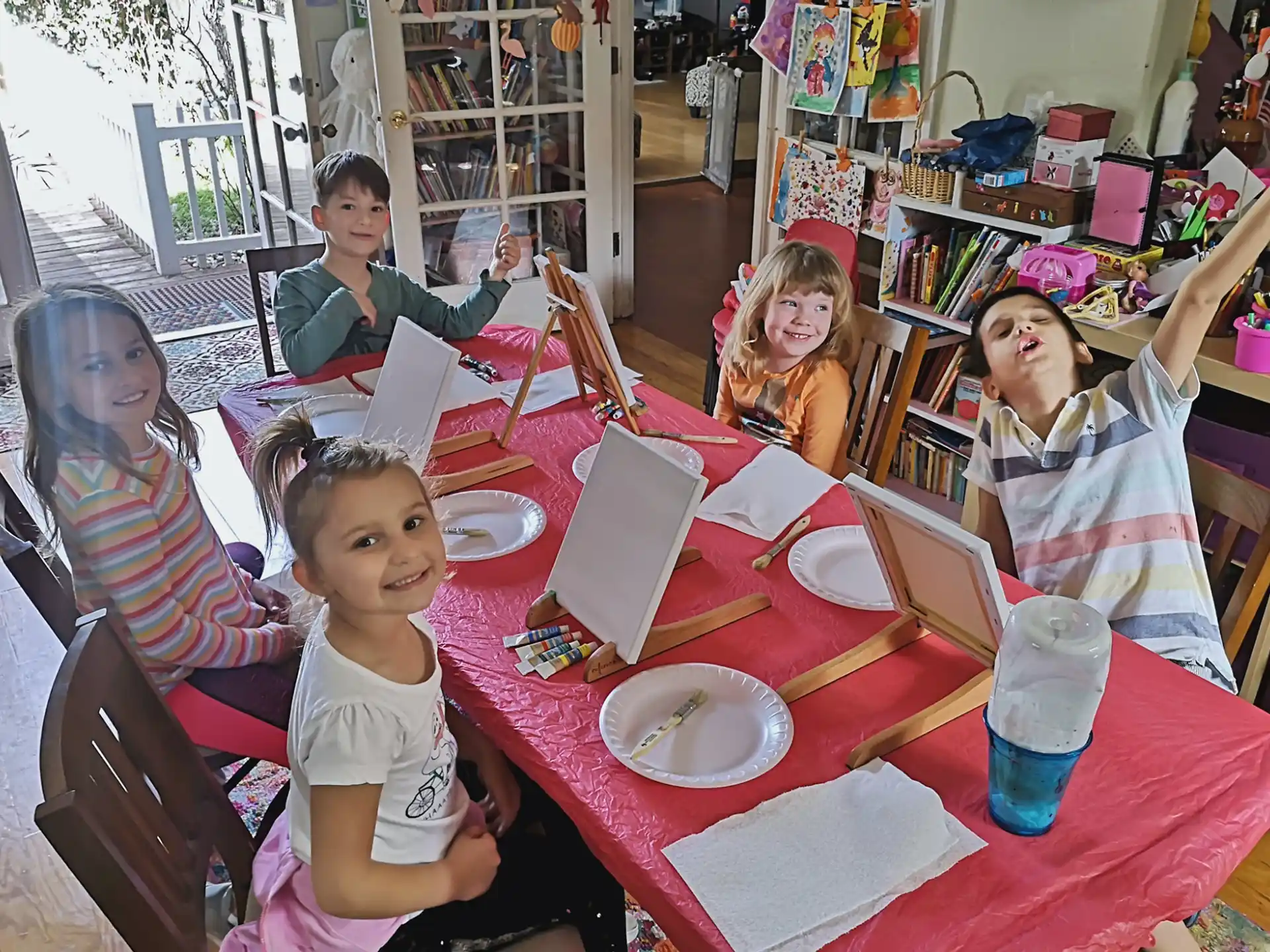 a group of children sitting at a table