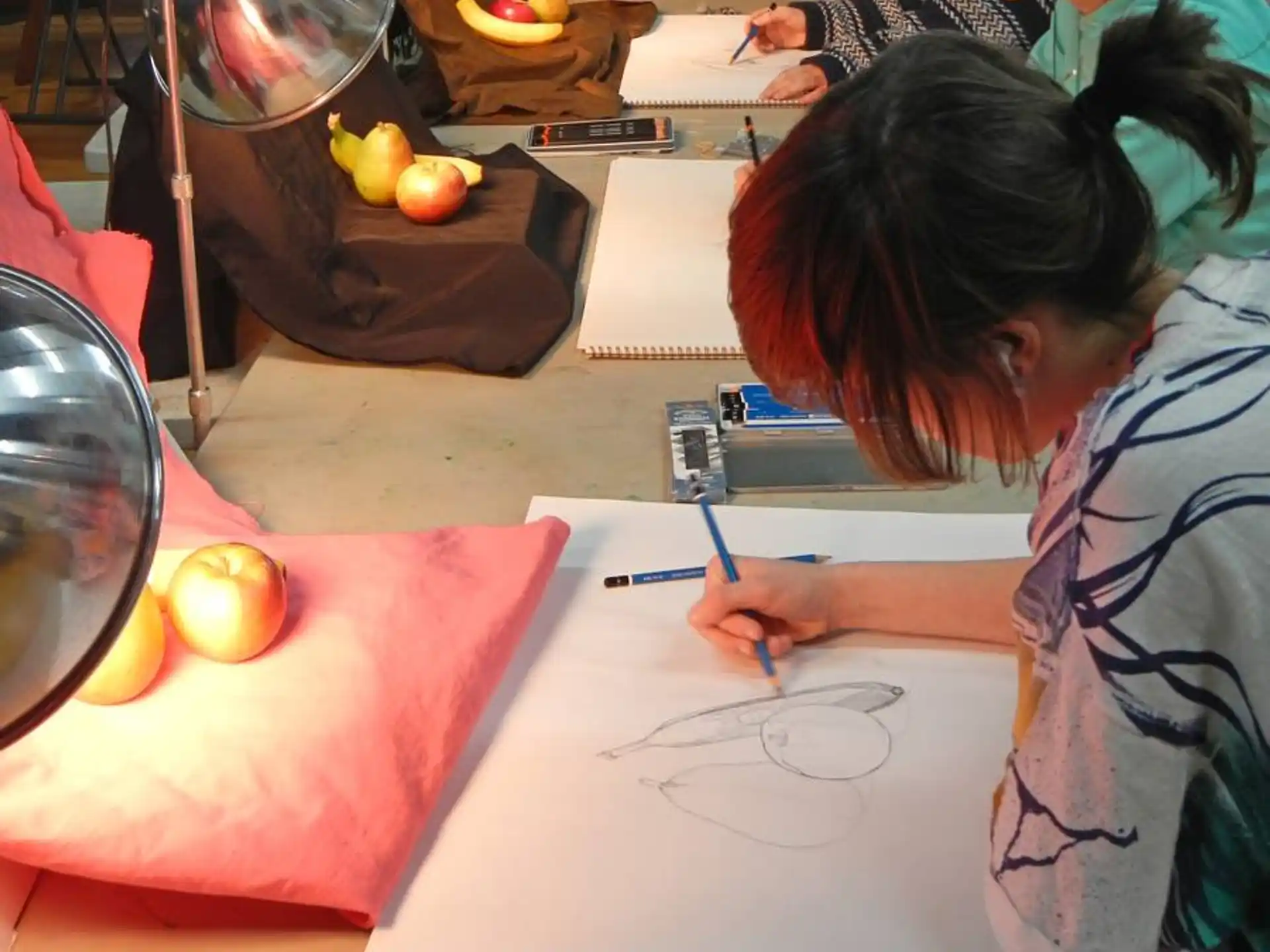 a person drawing on a paper