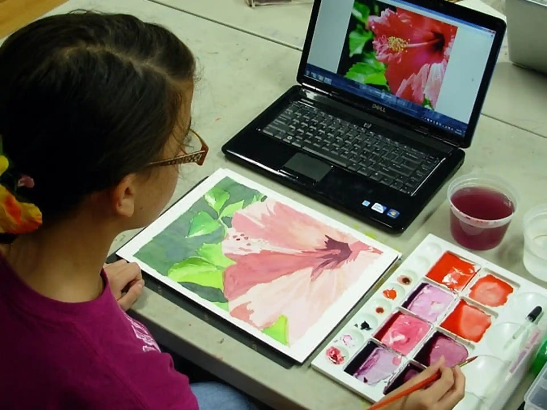 a person painting on a table