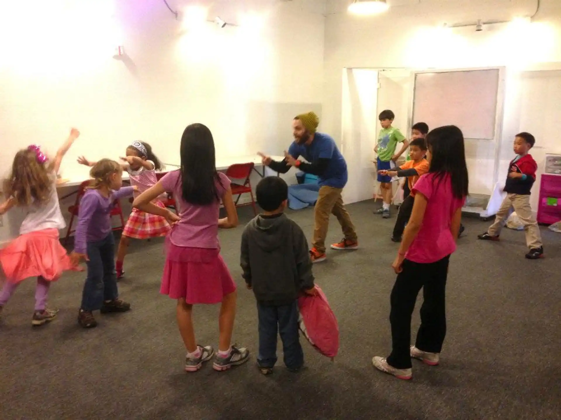 a group of children playing in a room