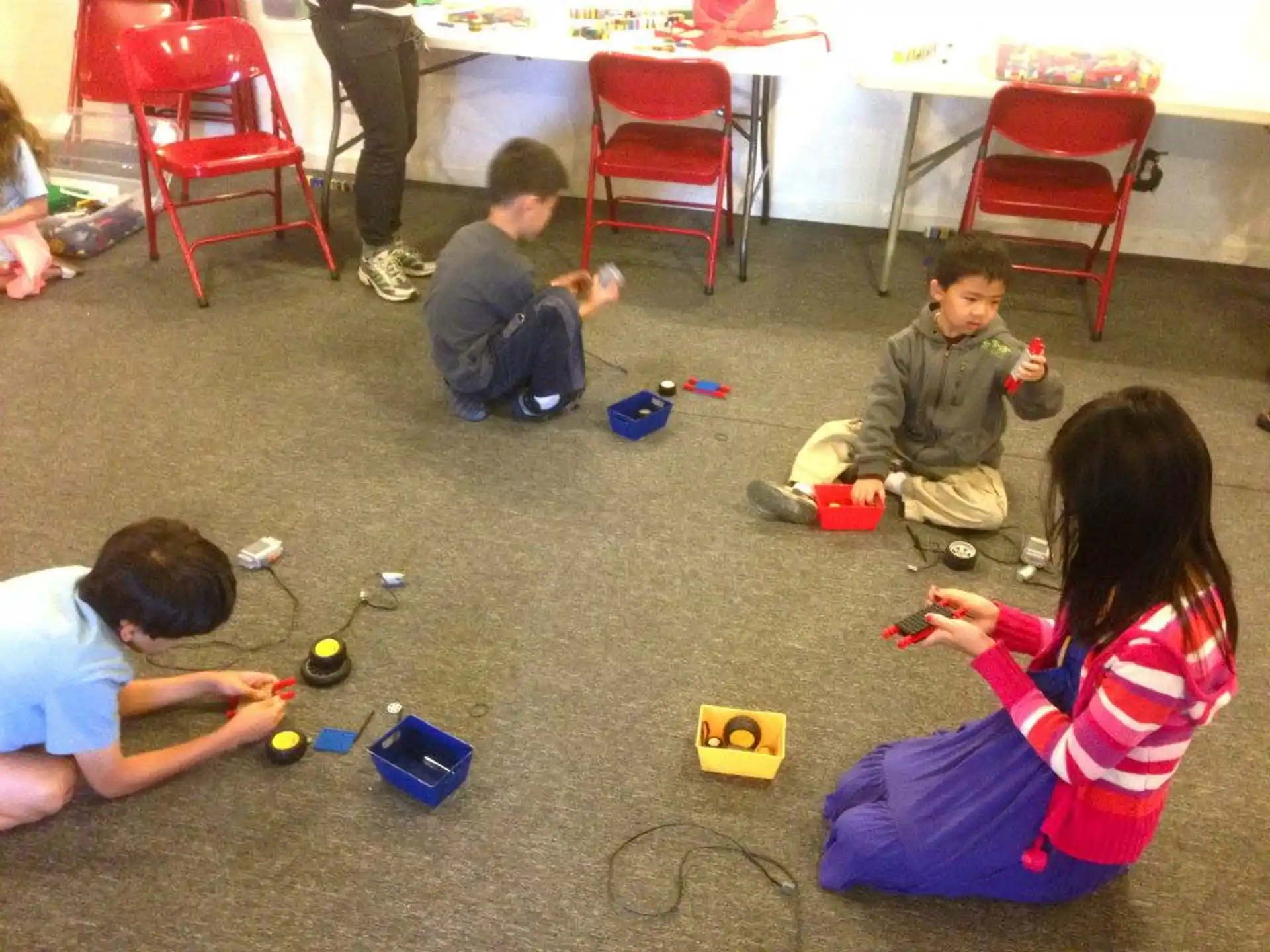 a group of children playing with toys