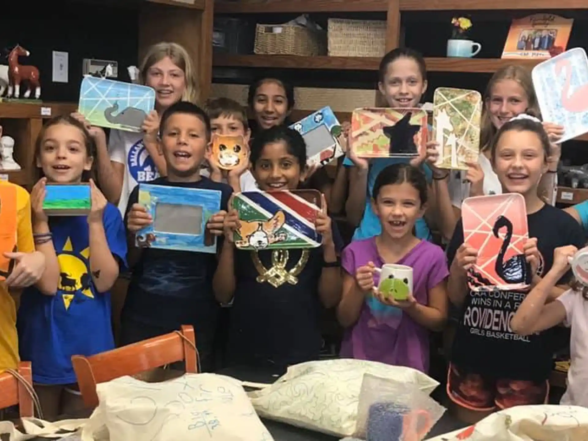 a group of children holding objects
