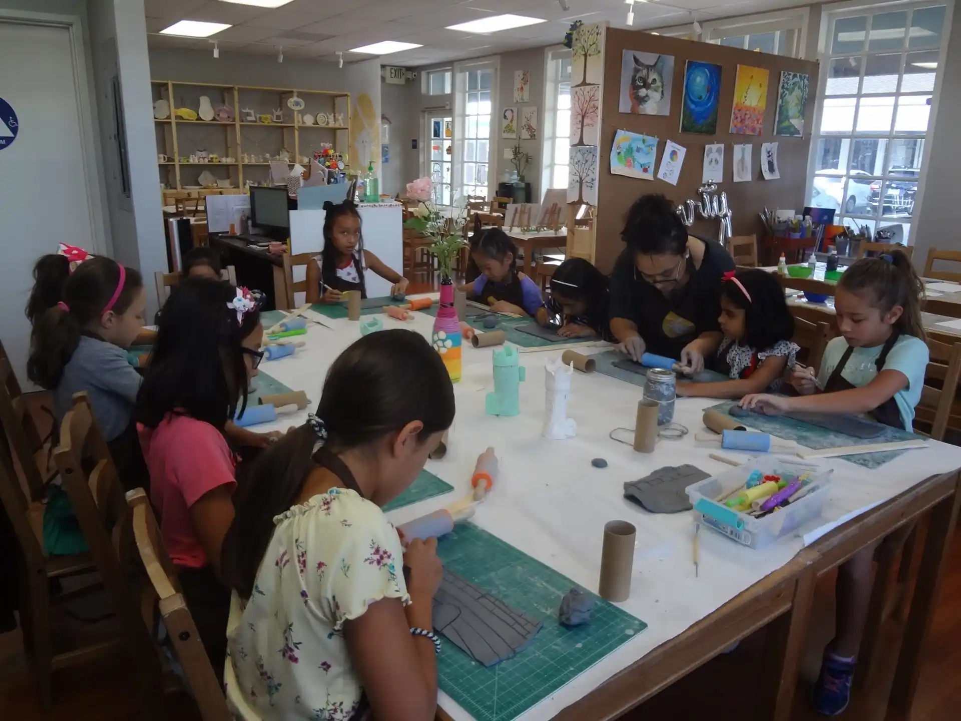 a group of children sitting at a table