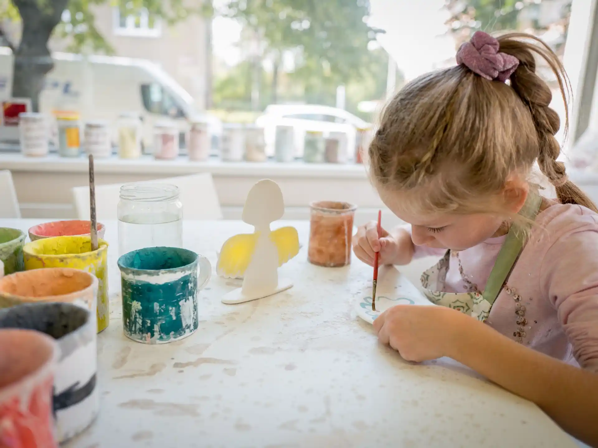 a little girl painting