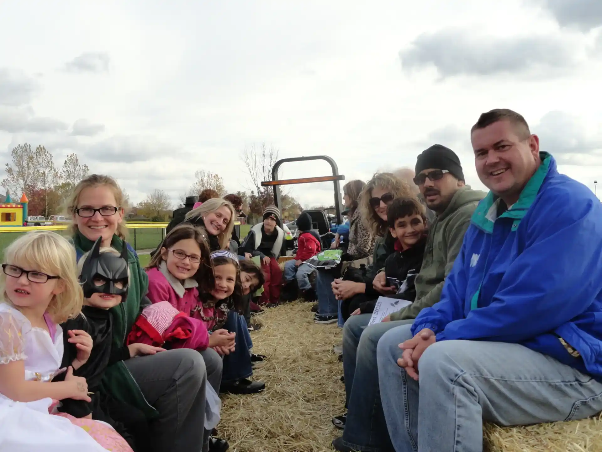 a group of people sitting together outside
