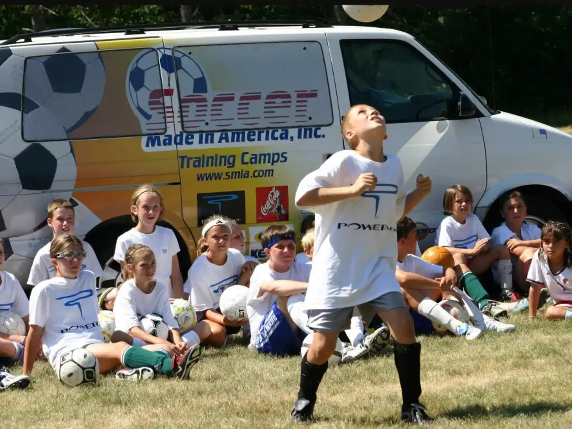 a person in a uniform standing in front of a group of kids