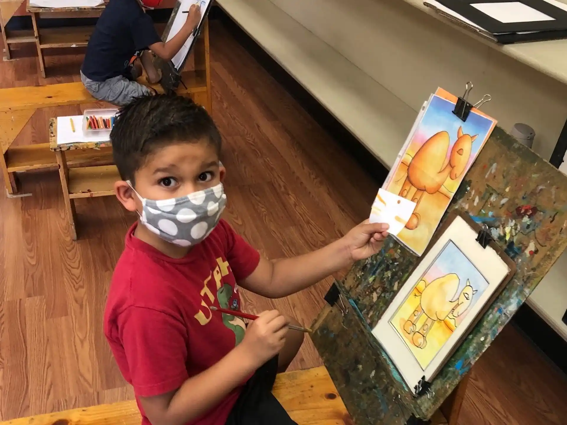 a boy holding a picture