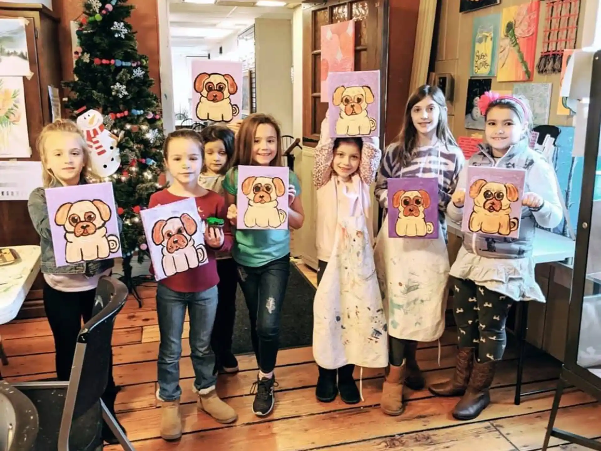 a group of children holding up books