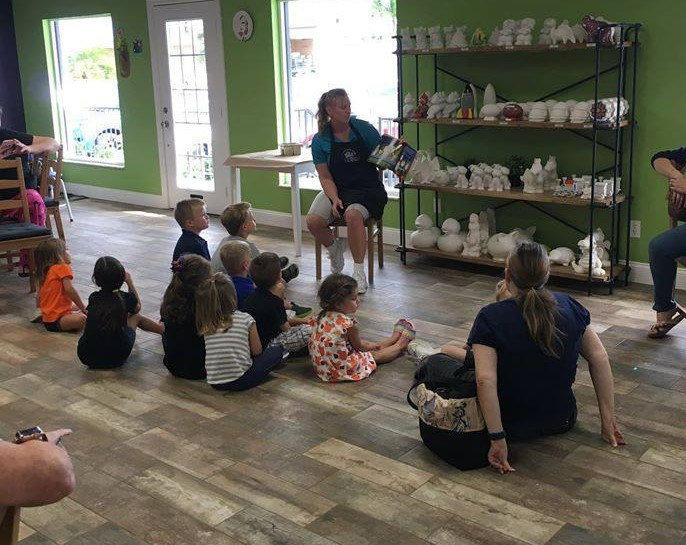 a group of people sitting on the floor