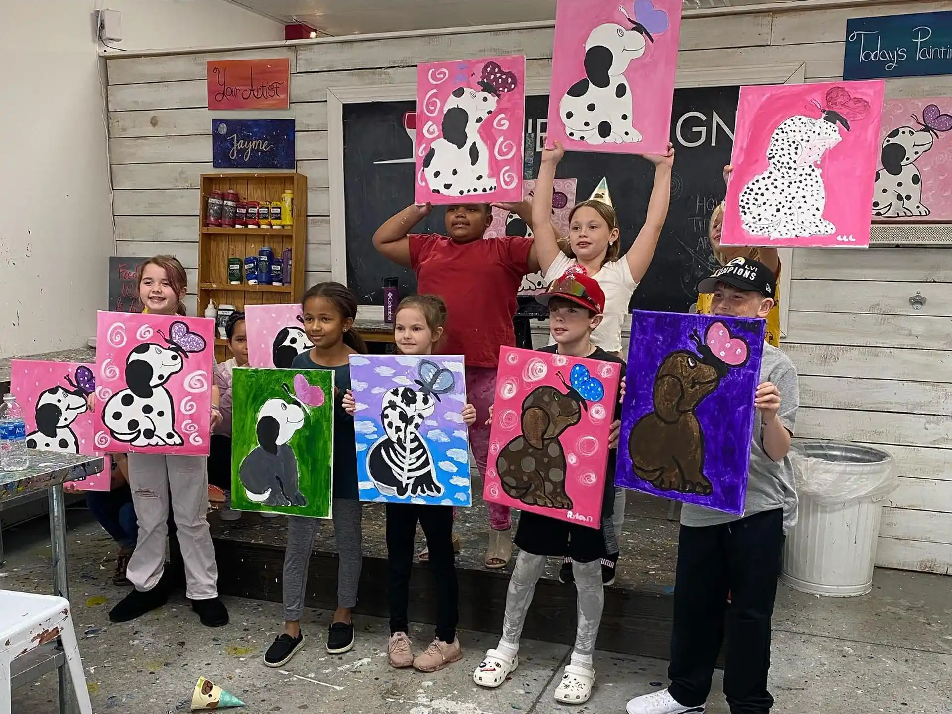 a group of kids holding signs