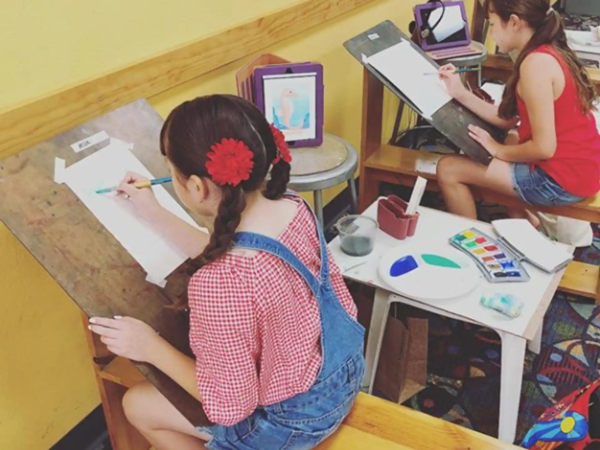 a couple of girls painting