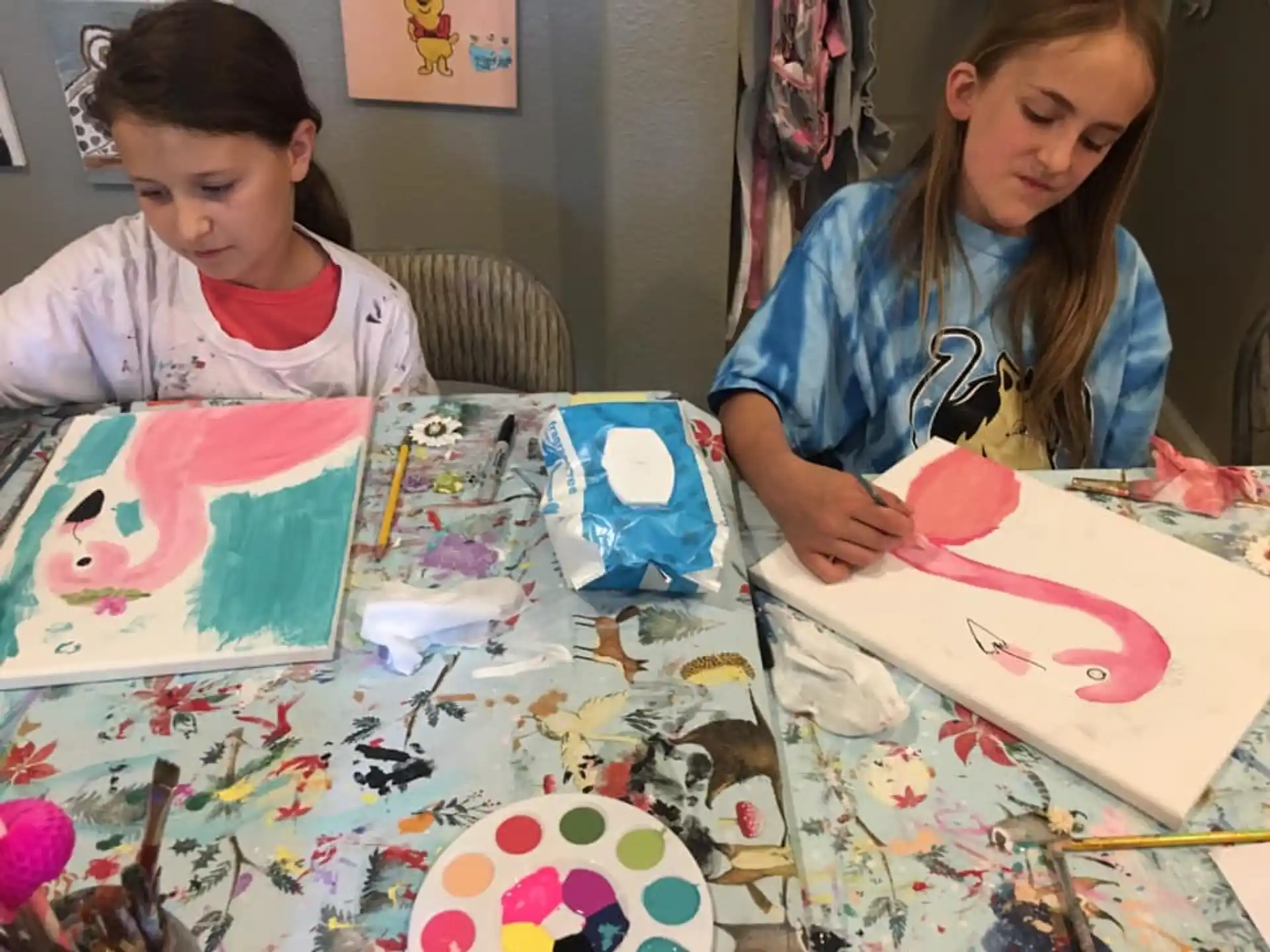 a couple of young girls painting