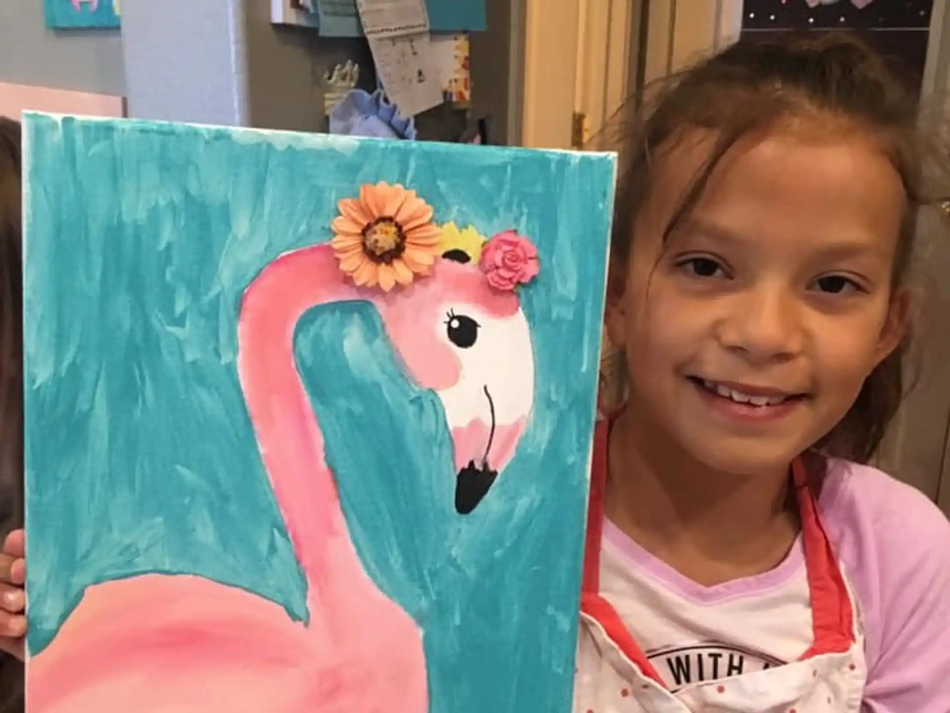 a girl holding a painting