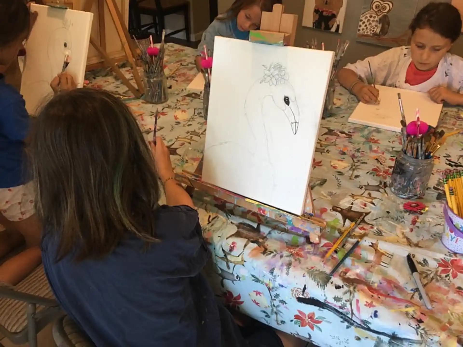 a group of children painting