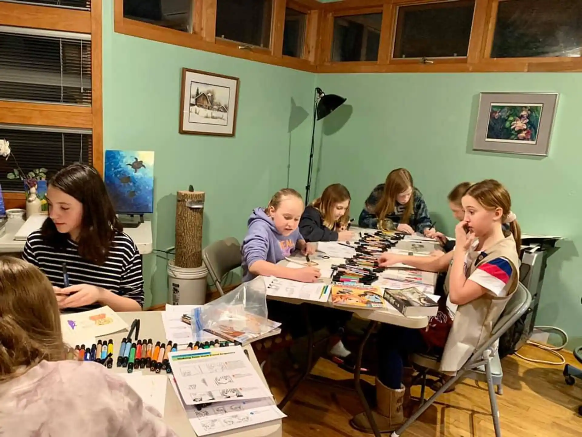 a group of people sitting around a table