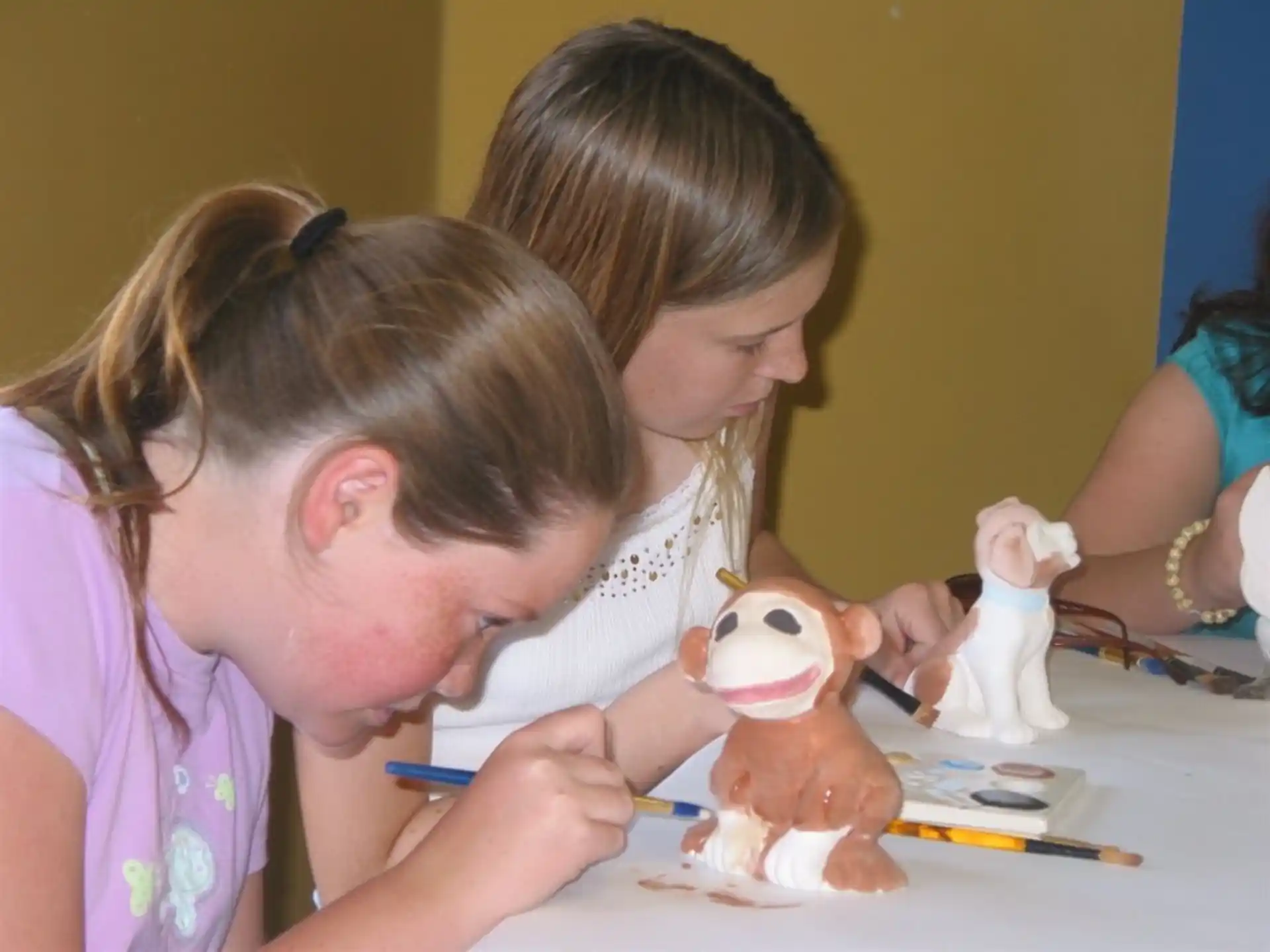 a person and a child painting