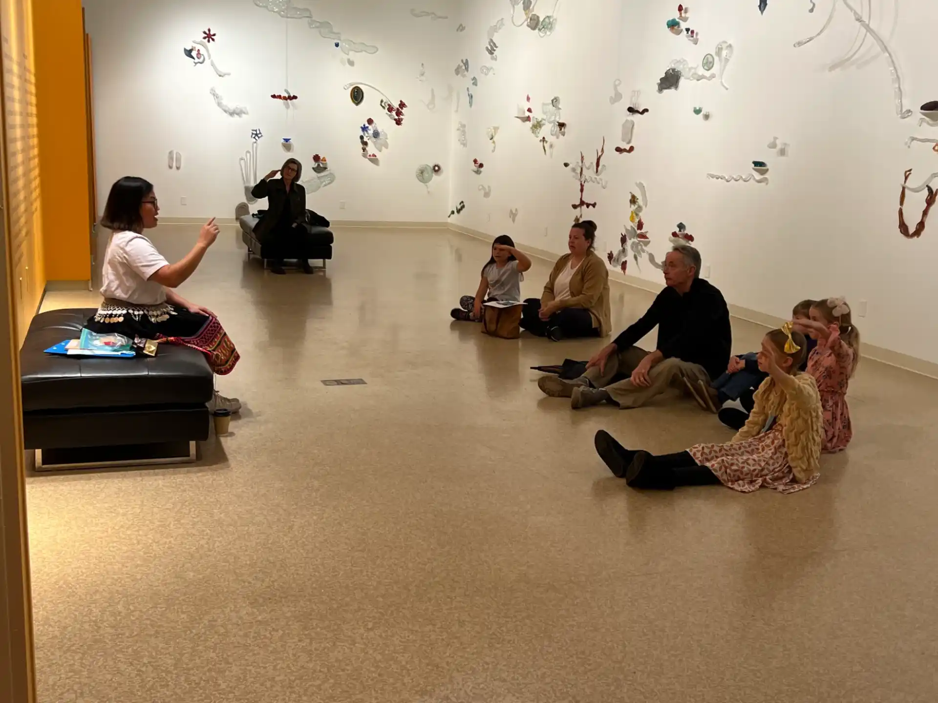 a group of people sitting on the floor