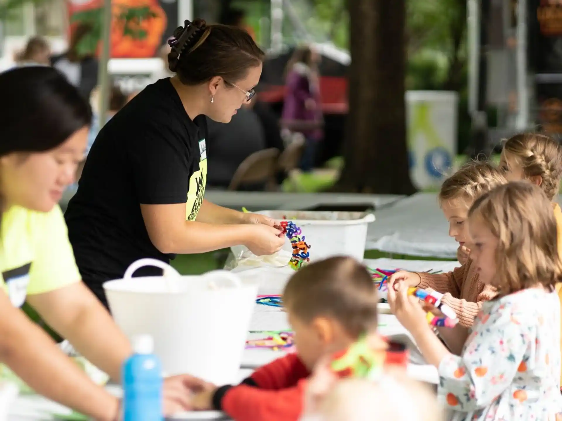 a person and children at a table