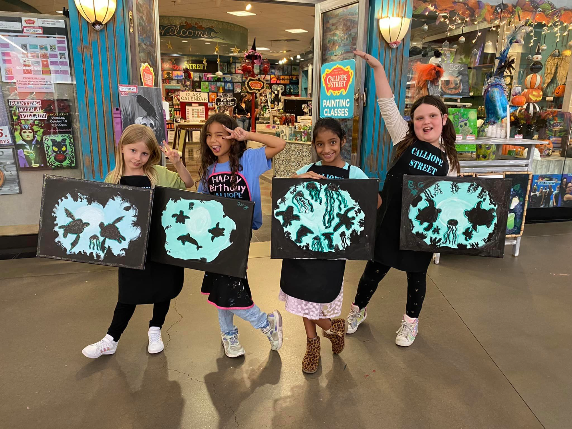 a group of girls holding signs