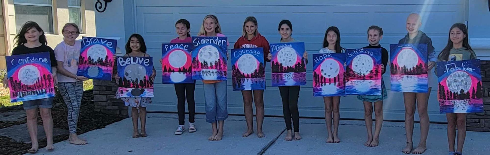 a group of women holding signs