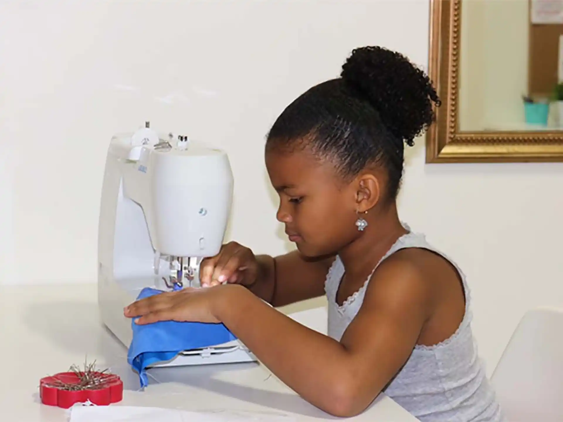 a person using a sewing machine