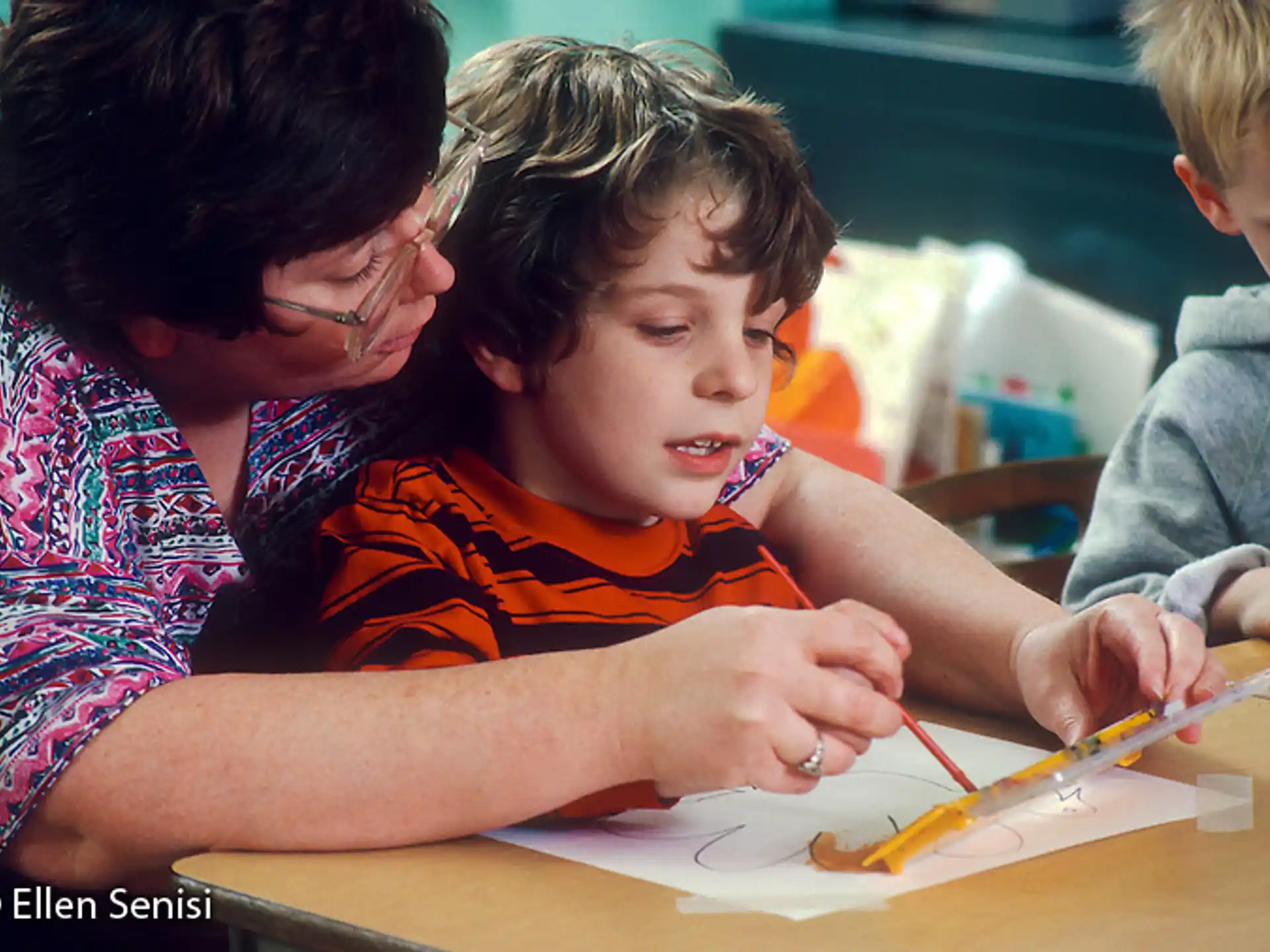 a person and a child painting