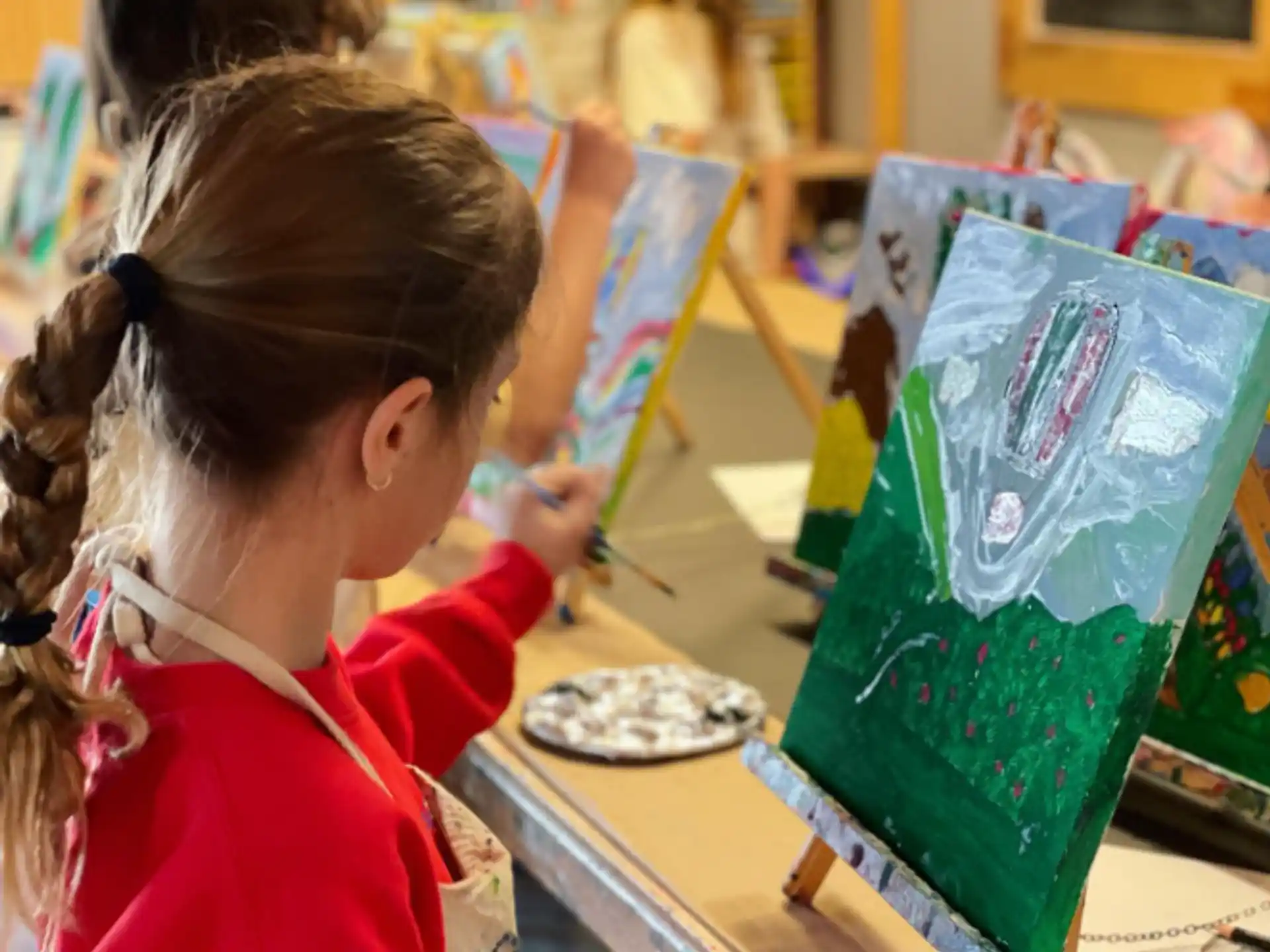 a young girl painting