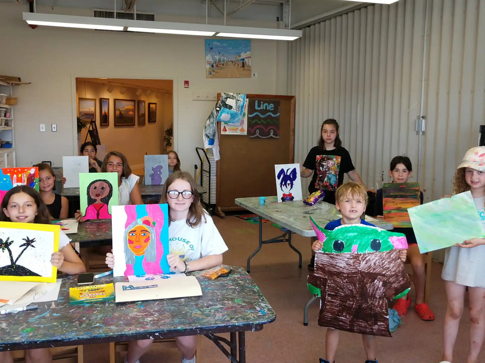 a group of children holding up books