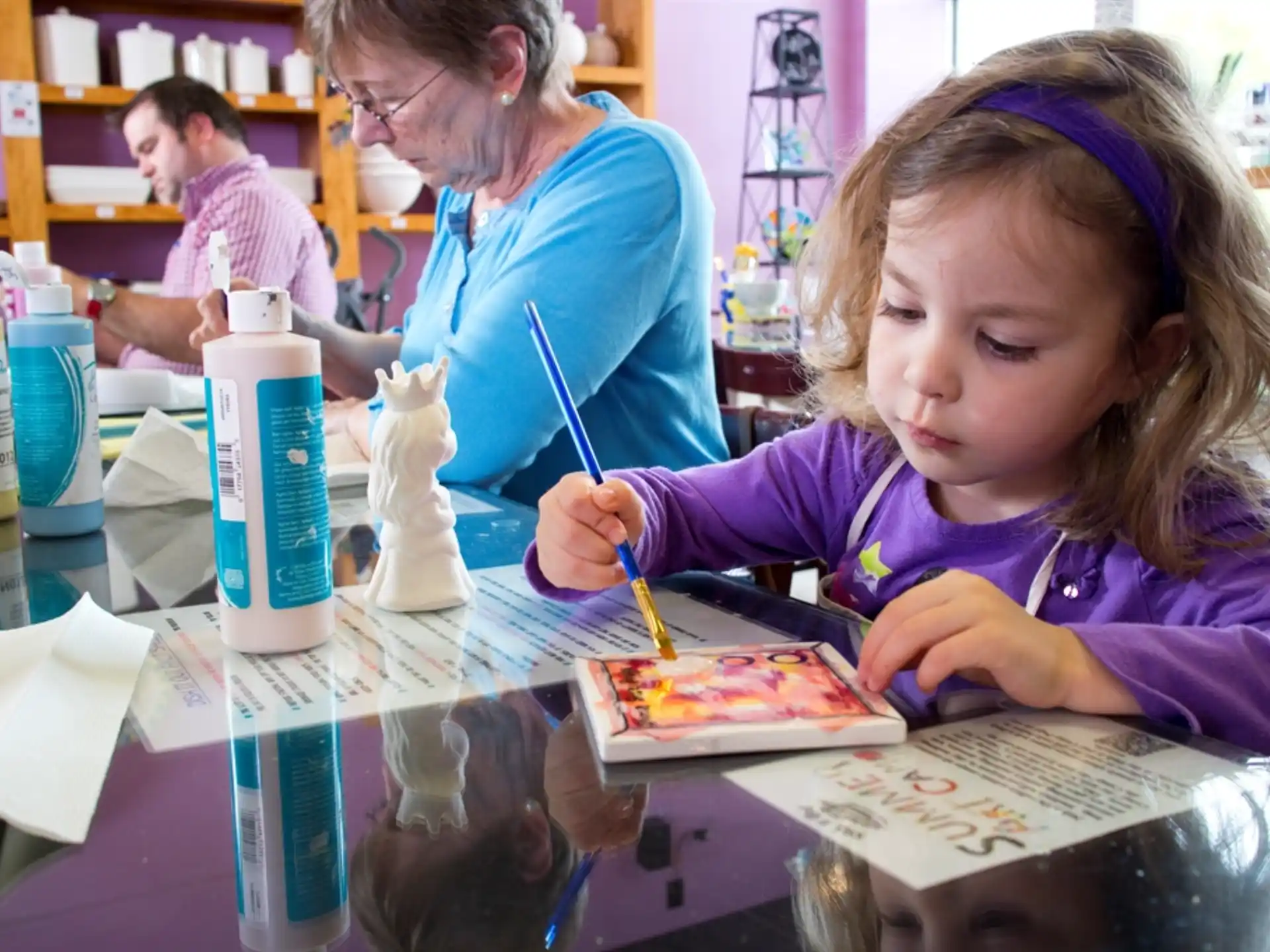 a young girl painting