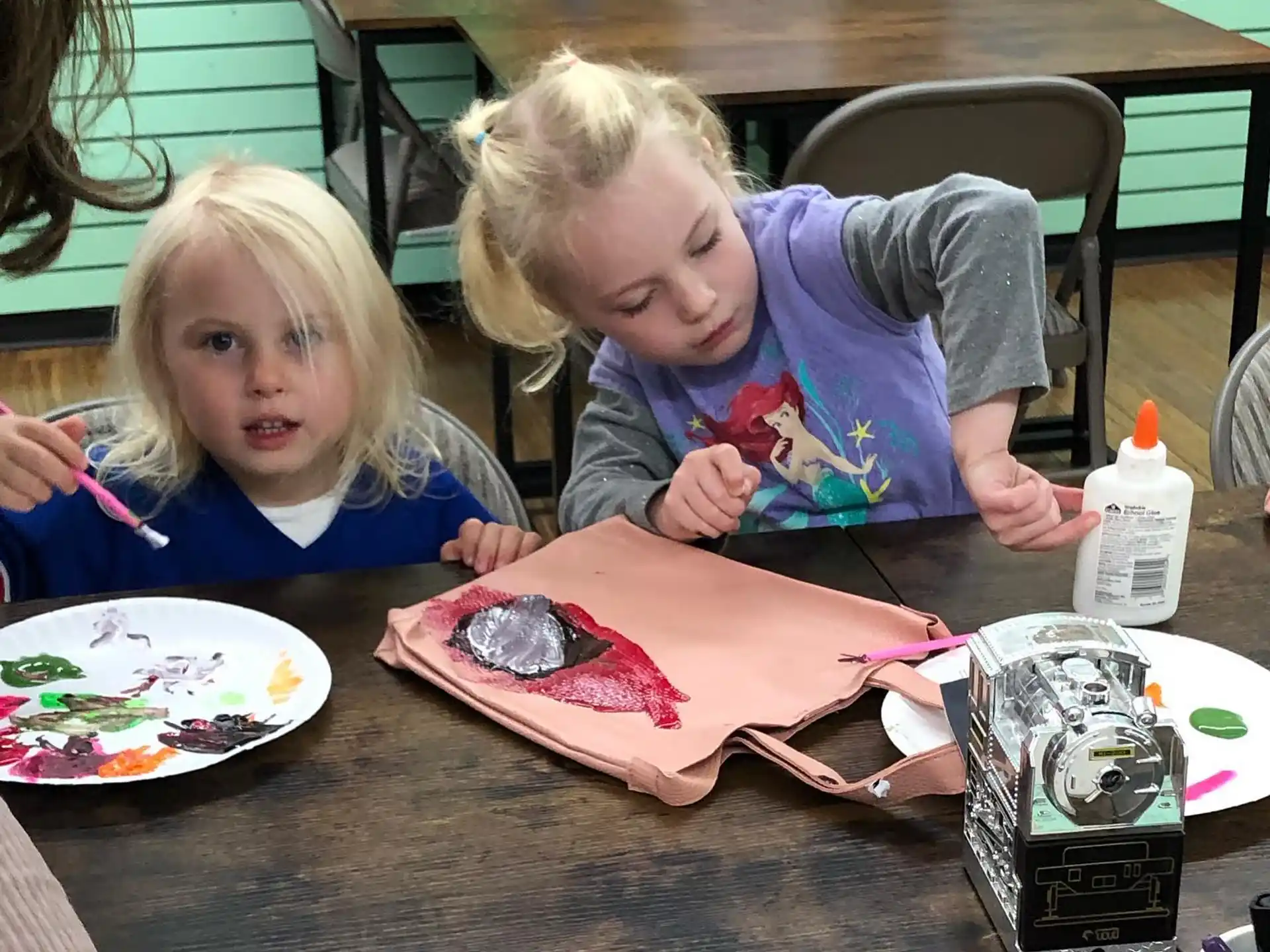 a couple of children eating cake