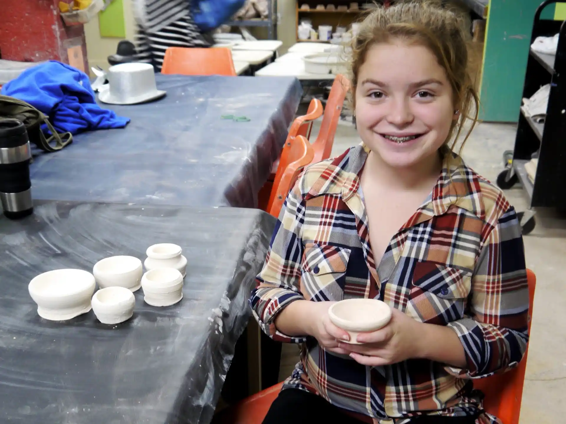 a person holding a cup of coffee