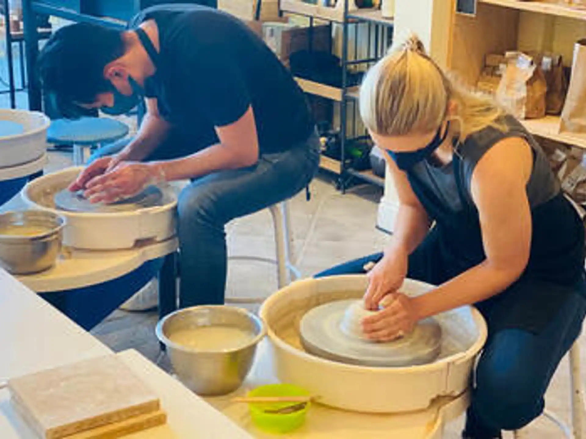 a man and a woman preparing food