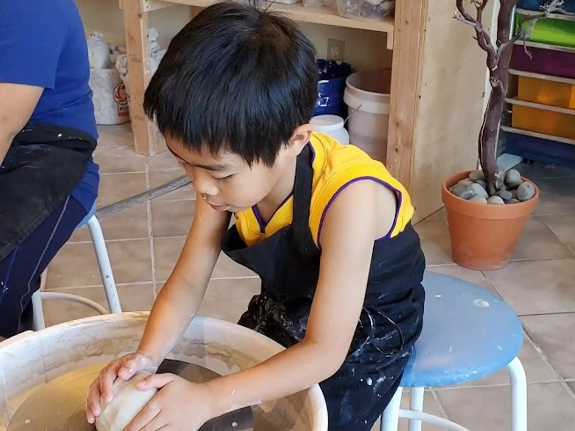 a young boy washing his hands
