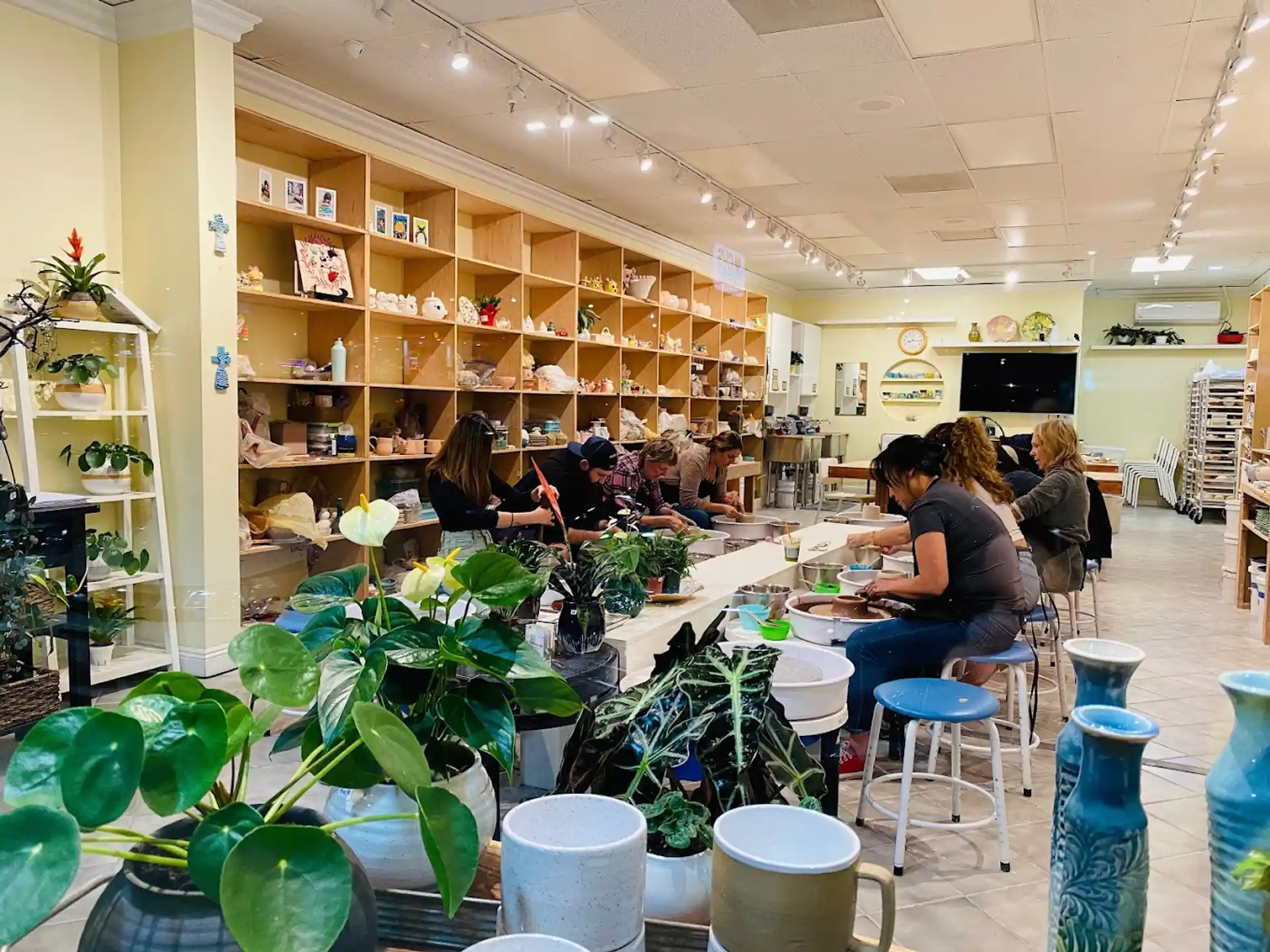 people sitting at tables in a library