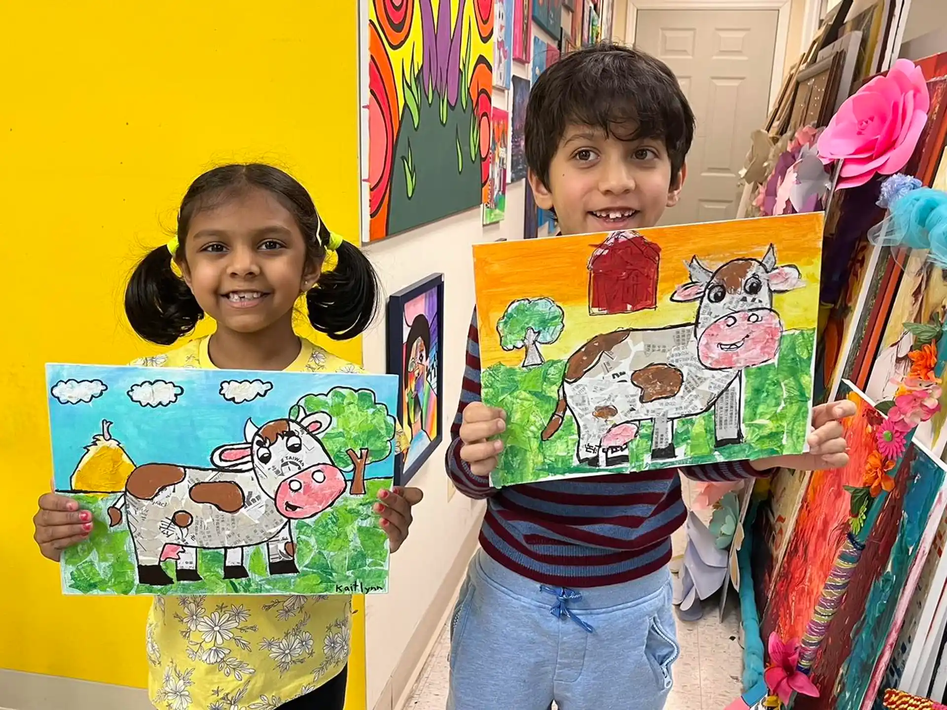 a couple of children holding books