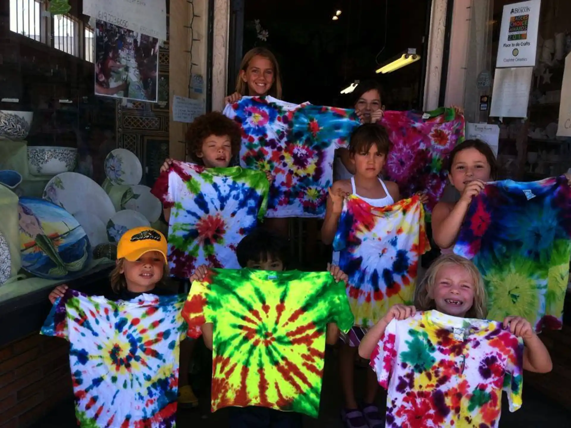 a group of children holding colorful umbrellas
