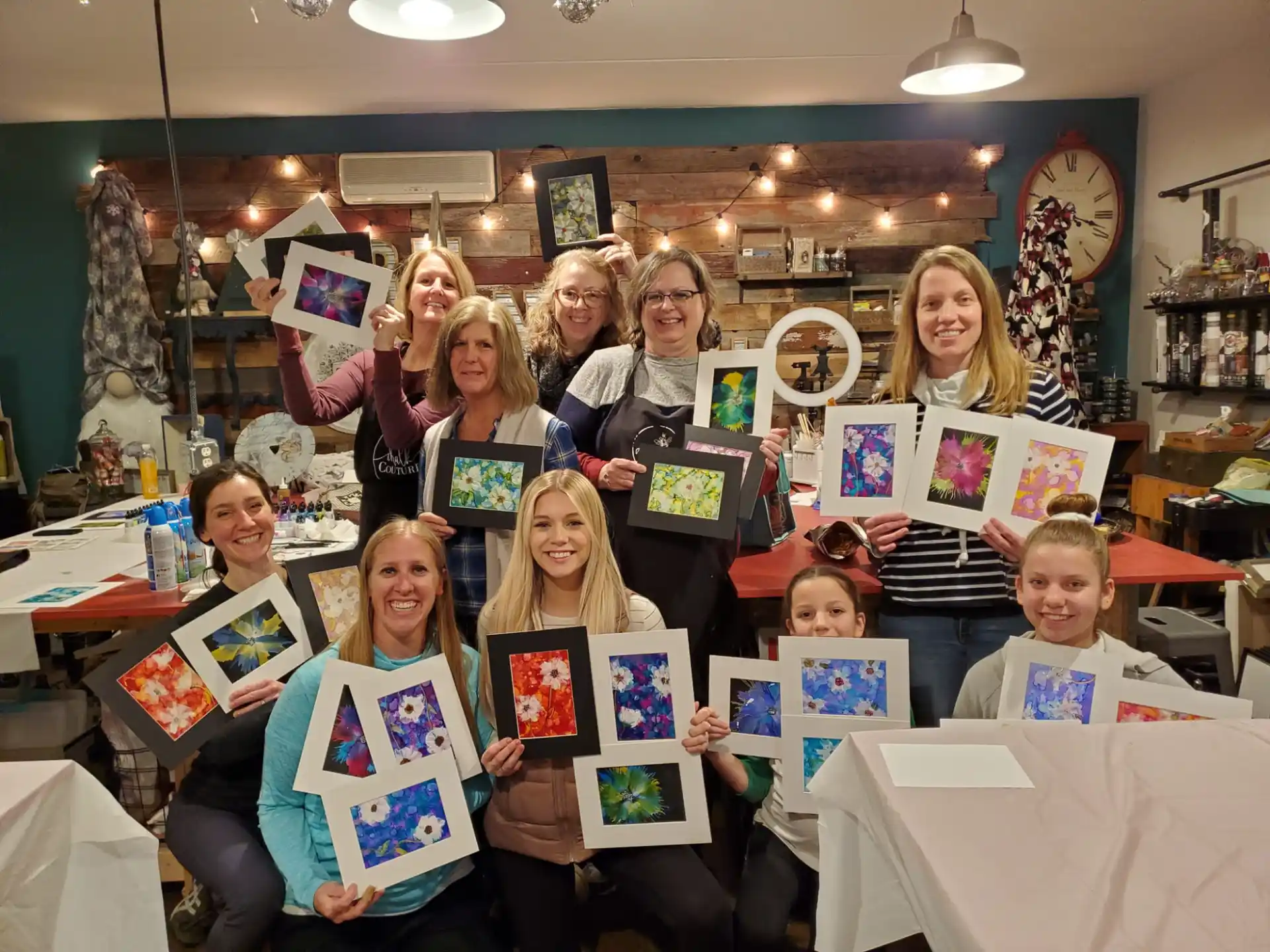a group of people holding certificates