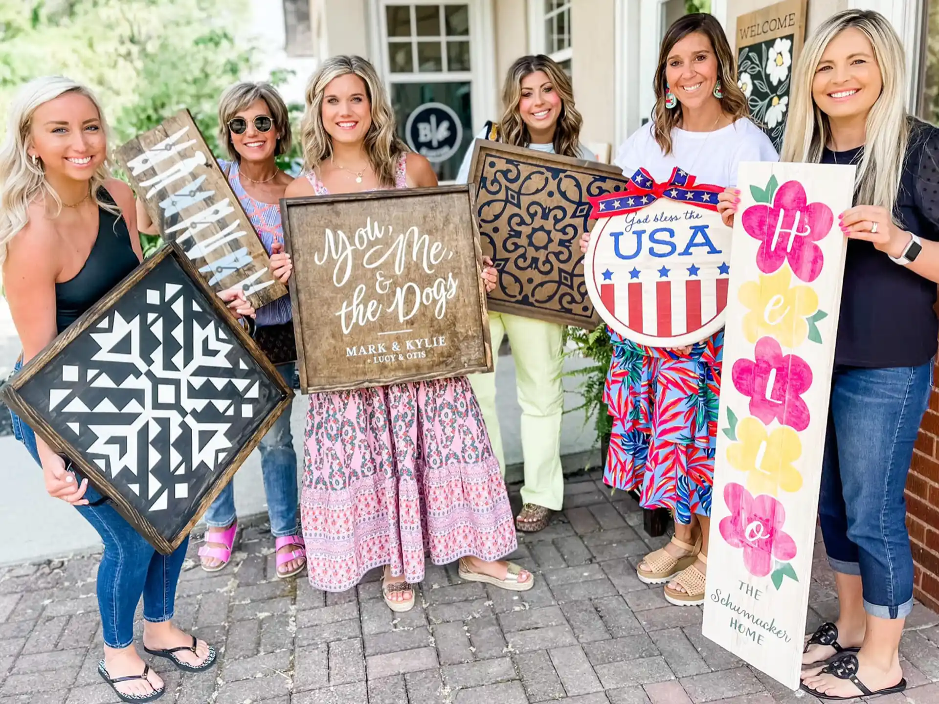 a group of women holding signs