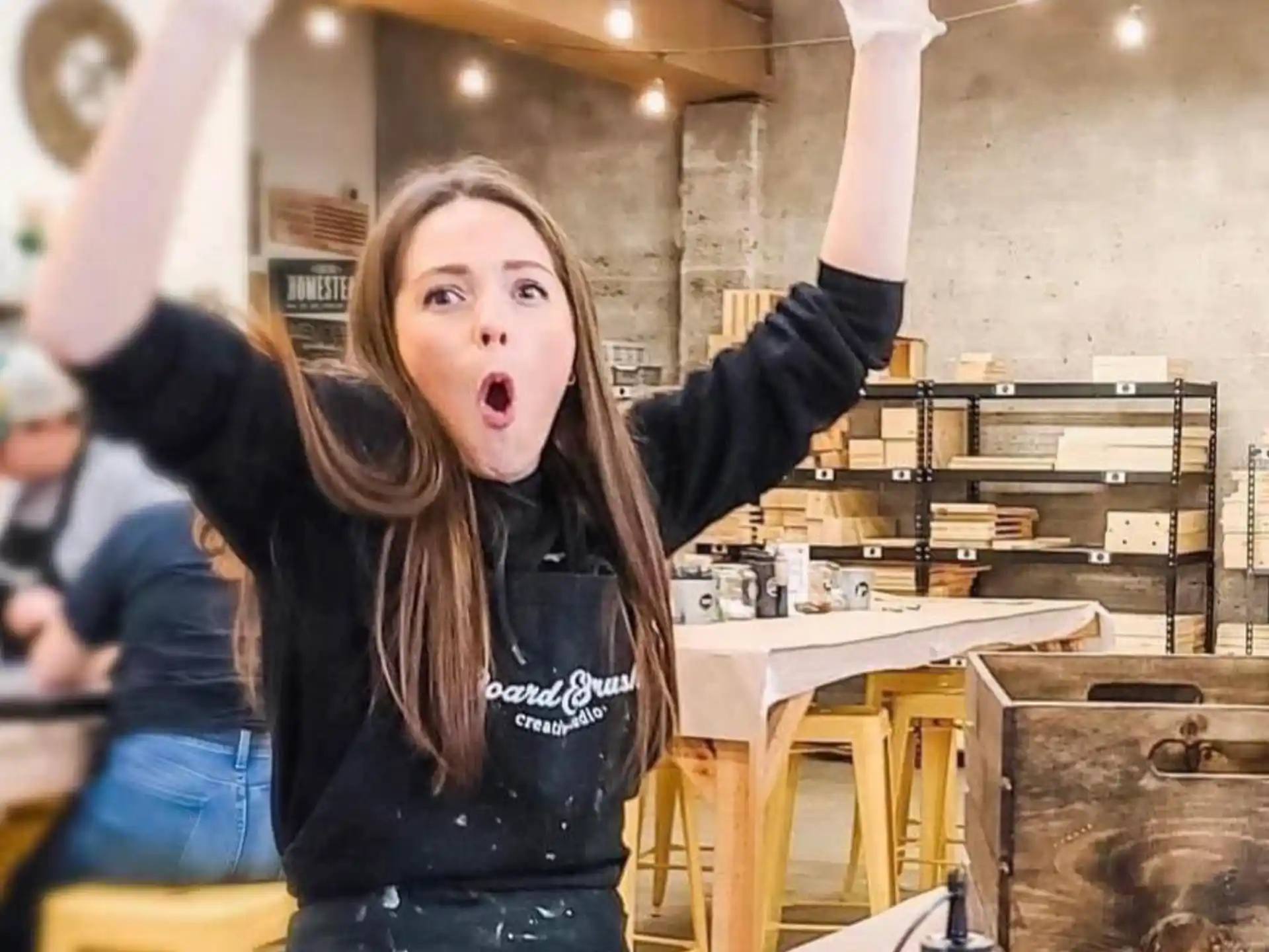 a person with the arms raised