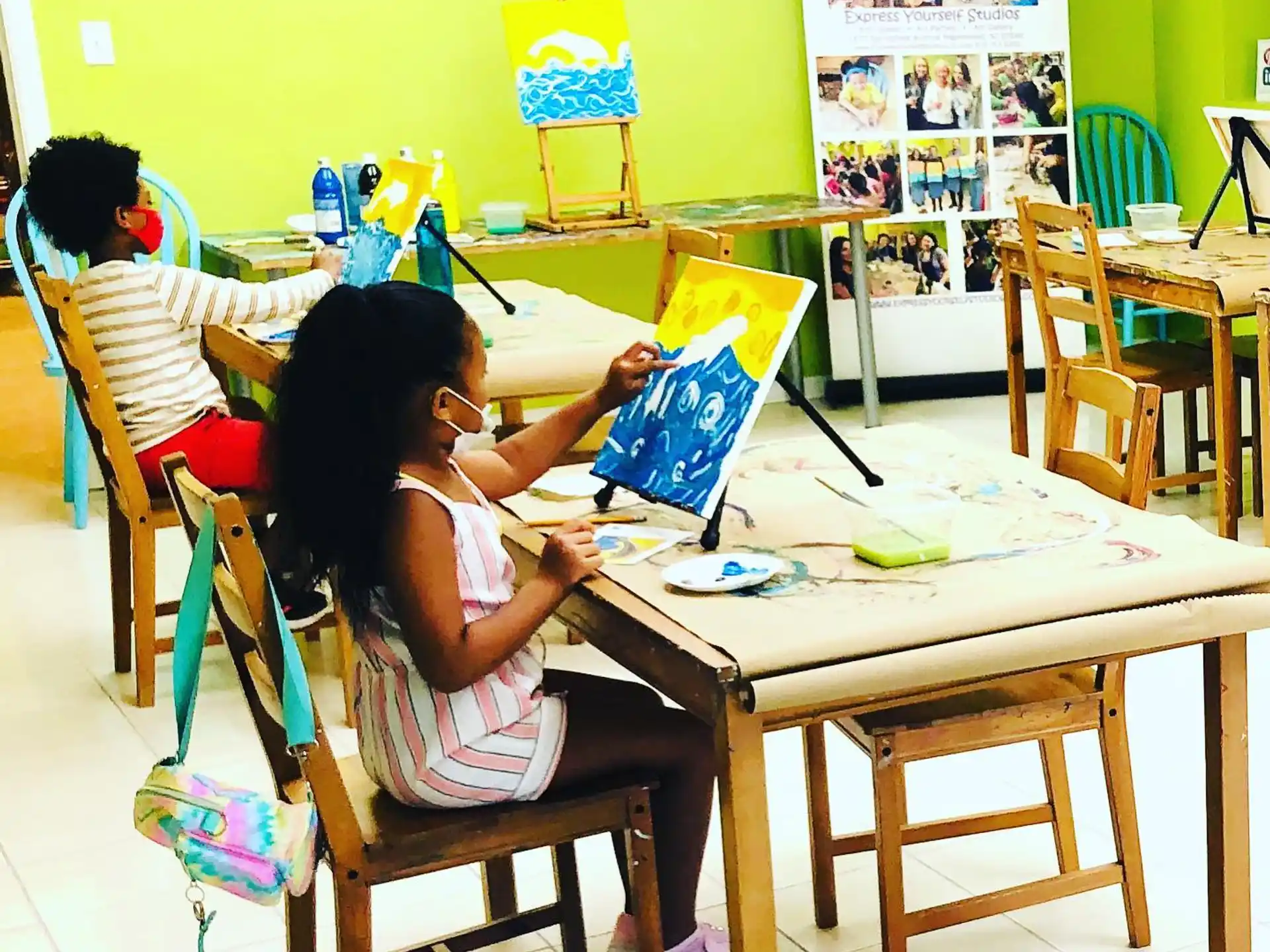 a few children sitting at a table